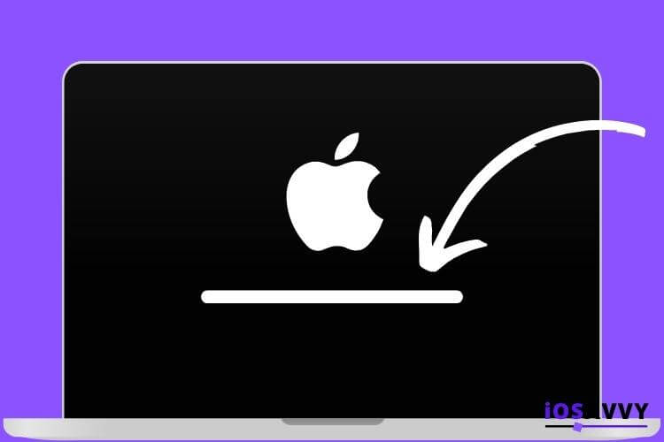 Macbook pro laptop with the loading logo on screen